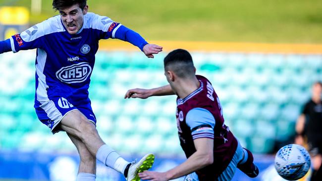 Max Burgess,left, of Olympic competes for possession against Paul Galimi of the APIA. Picture: Brendan Esposito