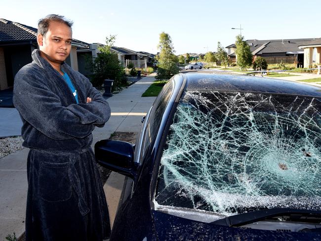 Imtiaz Rahman next to his car, which was damaged by people from the party house in Werribee. Picture: Nicole Garmston