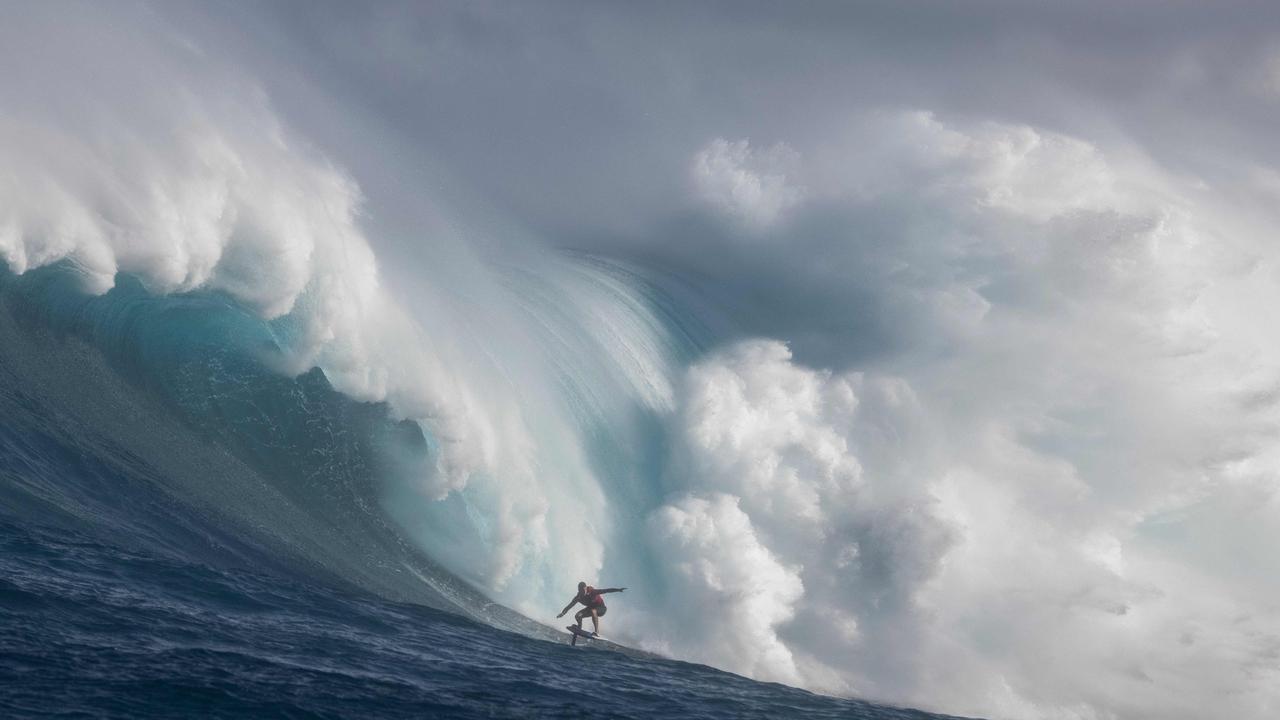 Spanish foilboard surfer Matt Etxebarne rides a wave during a huge swell at Jaws in Maui, Hawaii. Picture: Brian Bielmann/AFP