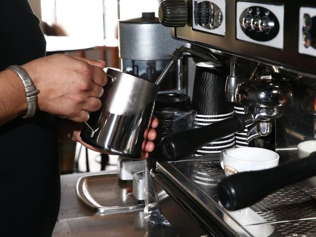 Generic photo of a barista making coffee.