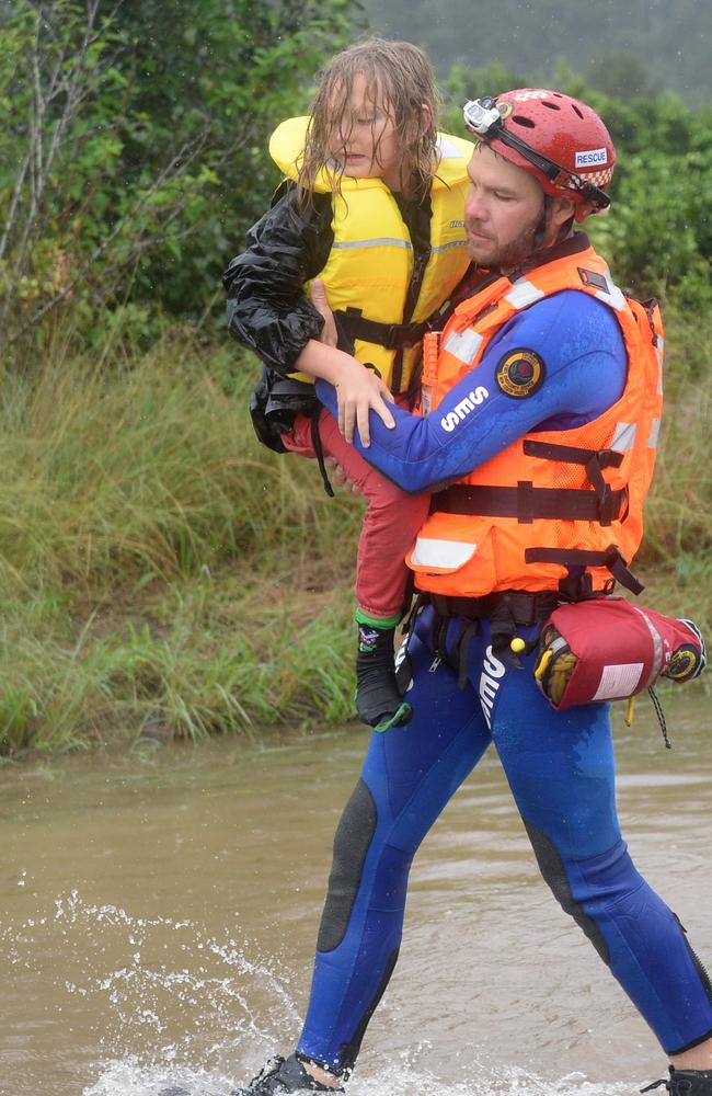 A family is rescued from floodwaters as the water levels threatened their Upper Colo home. Picture: NCA NewsWire / Jeremy Piper