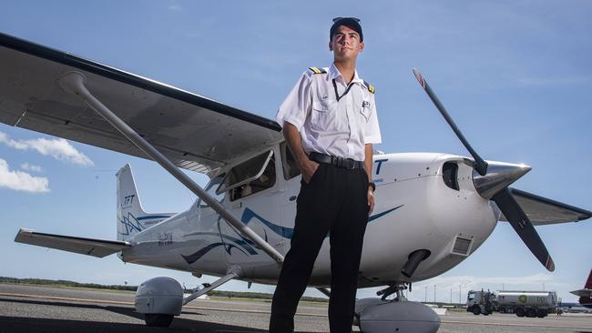 Cairns flight instructor Flinn Kelly from Cairns Flight Training on the tarmac with his Cessna 172 aircraft. Picture: Brian Cassey