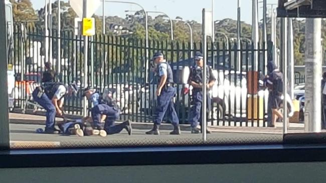 Police officers around Hampton after he was shot. Picture: 9 News