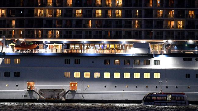 A tender craft approaches the cruise ship Celebrity Solstice in Sydney Harbour on Saturday. The federal government allowed a number of cruise ships that have been sitting off the NSW coast to come into Sydney Harbour to be replenished before heading back to their home ports.