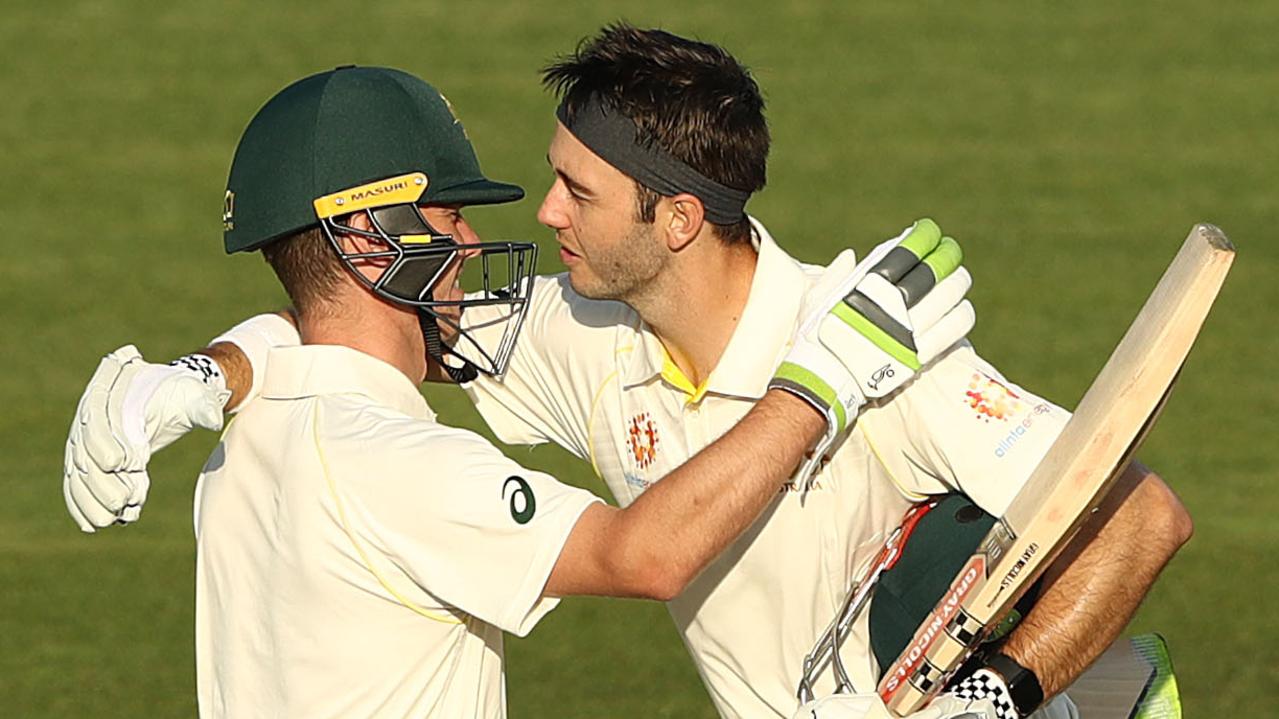 Jake Doran congratulates Kurtis Patterson of Australia after he made his century in Hobart.