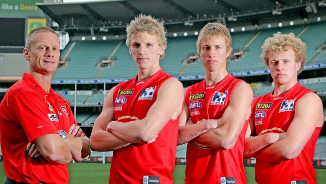 Last man standing – Trent McKenzie with Matt Shaw and Joshua Toy – with then coach Guy McKenna as Gold Coast 17-year-olds.