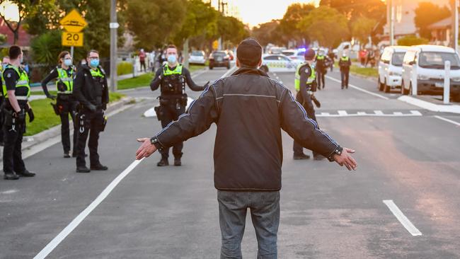 Police threatened to use pepper spray in a tense stand-off with anti-lockdown protesters in Dandenong last week. Picture: Jason Edwards