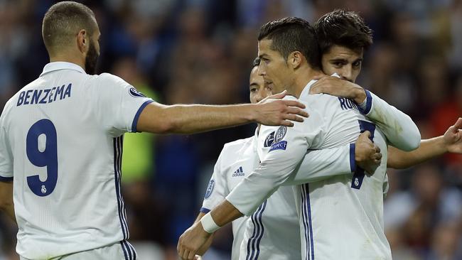 Real Madrid's Alvaro Morata, right, celebrates with Cristiano Ronaldo and Karim Benzema.