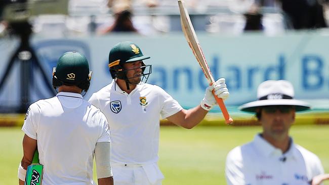 South Africa's batsman AB de Villiers (C) celebrates after scoring a half-century.