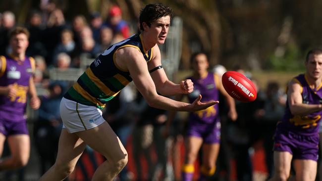 Ethan Phillips of St Kevin’s hand balls during the 2018 VAFA Premier grand final. Picture: Hamish Blair