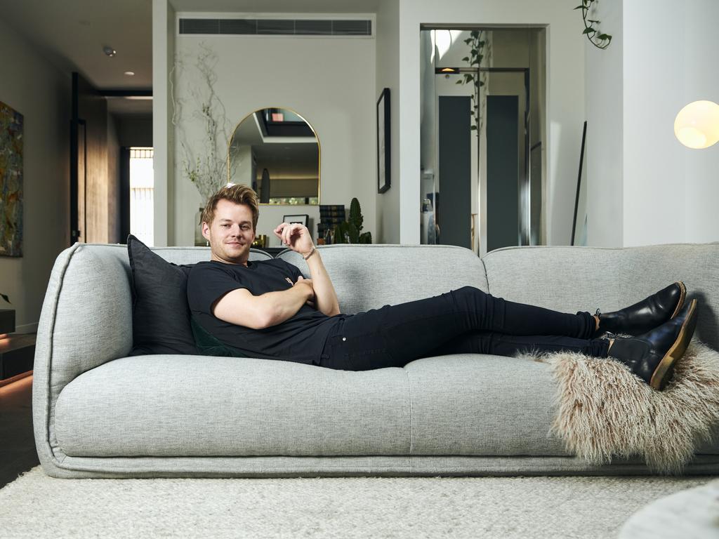 Joel Creasey relaxes at home ahead of Mardi Gras. Picture: Eugene Hyland