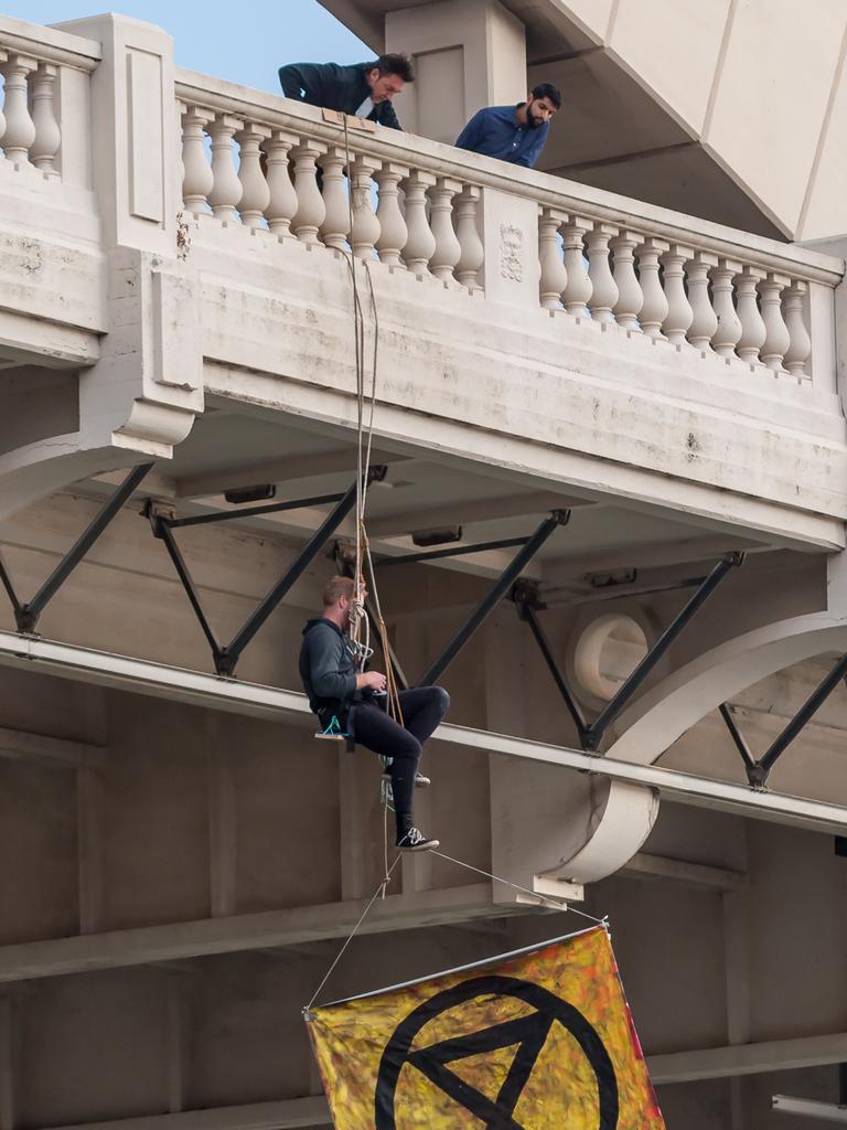 Extinction Rebellion protester abseiling William Jolly Bridge. 19 August 2019. Picture: Supplied.