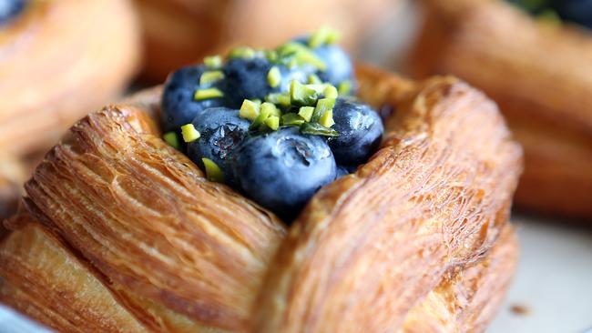 BamBam Bakehouse is the new hit cafe at Mermaid Beach, from the creators of Paddock Bakery. Photo of Blueberry custard and pistachio danish. Pic by Richard Gosling