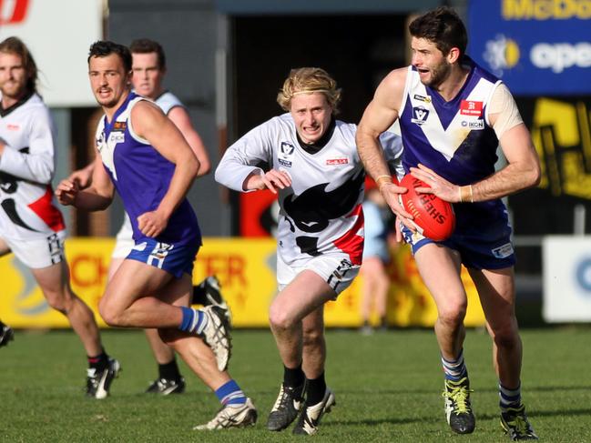 Ballarat Football League Round 17 match between Sunbury and North Ballarat. Sunbury 19.10 (124) defeated North Ballarat City 13.7 (85). The Lions Josh Burgess heads towards goal burning off his Rooster opponent. Picture: Aaron Cook