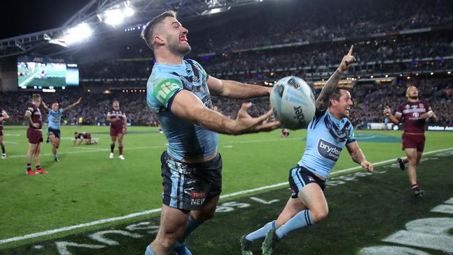 NSW's James Tedesco after his incredible try, as Mitchell Pearce takes off in celebration. Picture: Phil Hillyard