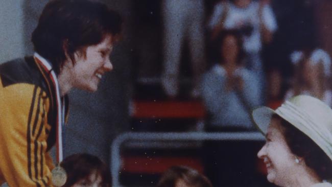 Tracey Wickham being presented with her gold medal for the 400m freestyle by Queen Elizabeth.