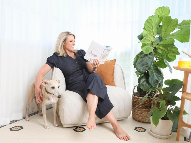 Moore enjoying her bedroom’s light-soaked reading nook with the family’s whippet Kink. The Moroso Rendondo swivel chair is by Hub Furniture. Picture: Renee Nowytarger