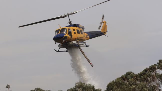 An out-of-control bushfire at Northmead had to be waterbombed during the extreme conditions.