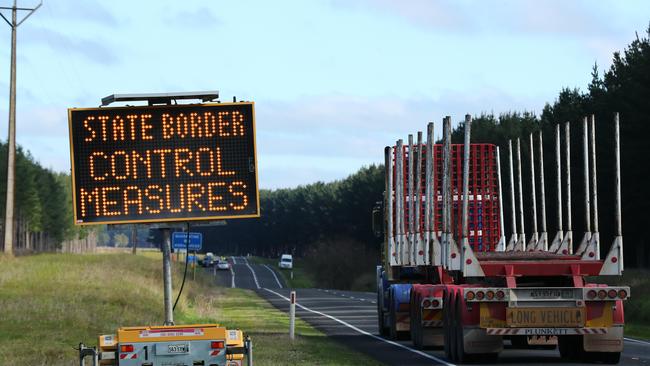 The duo allegedly crossed the border by driving between two trucks