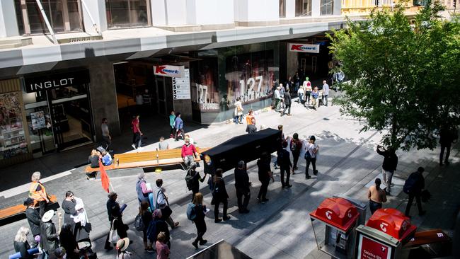 Pall bearers carry a coffin through the mall. Picture: AAP Image/ Morgan Sette