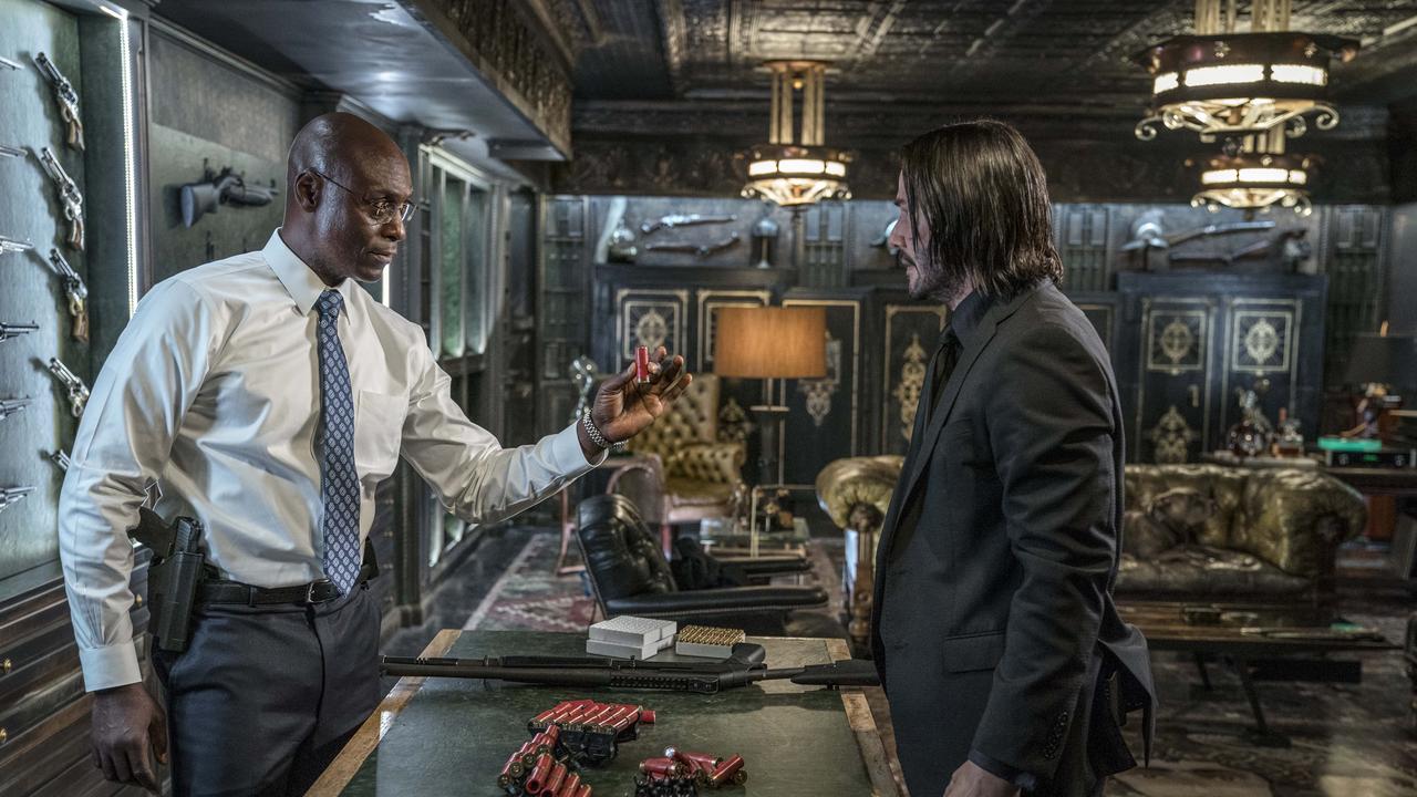 Lance Reddick as Charon with Keanu Reeves in John Wick.