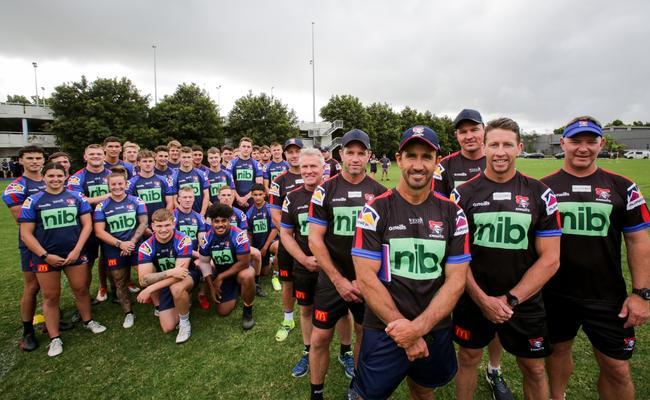 Junior players with coaching staff (L to R) Blake Green, Garth Brennan, Danny Buderus, Andrew Johns, Steve Simpson, Kurt Gidley and Adam O'Brien. Picture: Liam Driver