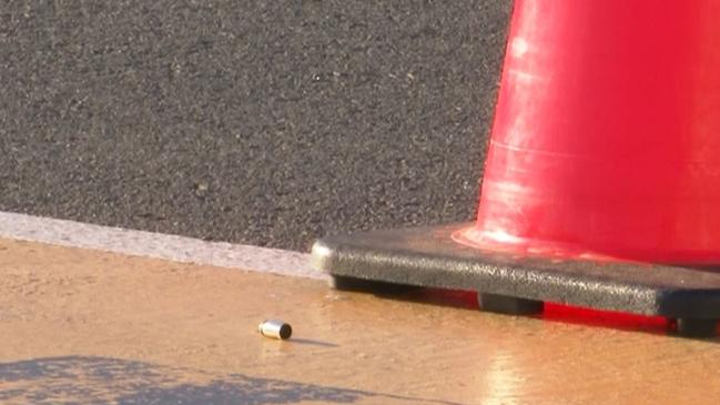 A bullet casing lays by a witches hat after the shooting. Picture: TNV