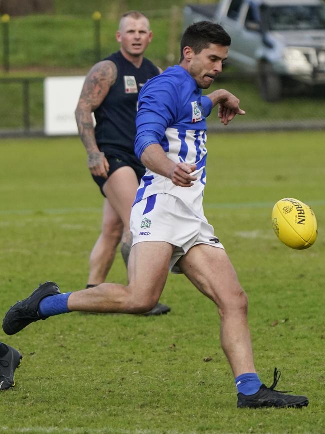 Outer East: Daniel Ellett gets a kick for Officer. Picture: Valeriu Campan