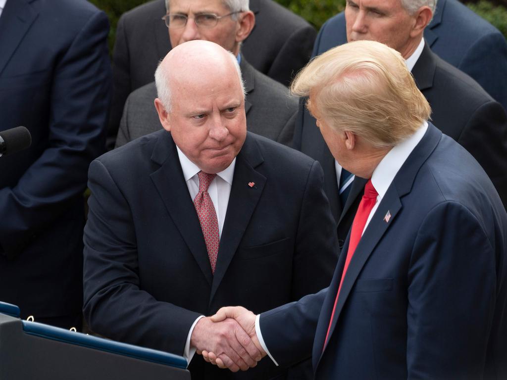 As President Donald Trump has discovered, stopping handshakes is easier said than done. Picture: JIM WATSON / AFP