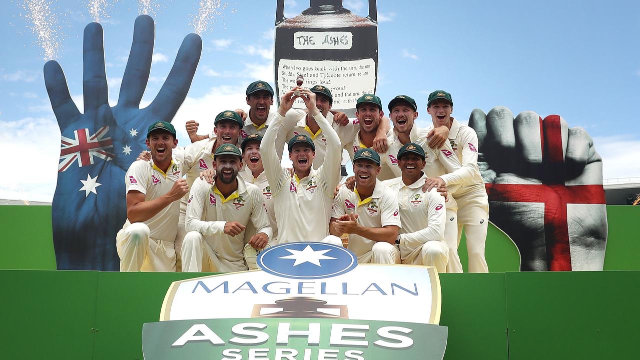 Former captain Steve Smith and his Australian teammates with the backdrop of the tasteless four-fingered salute after the Sydney Test in 2018. Picture: Getty Images