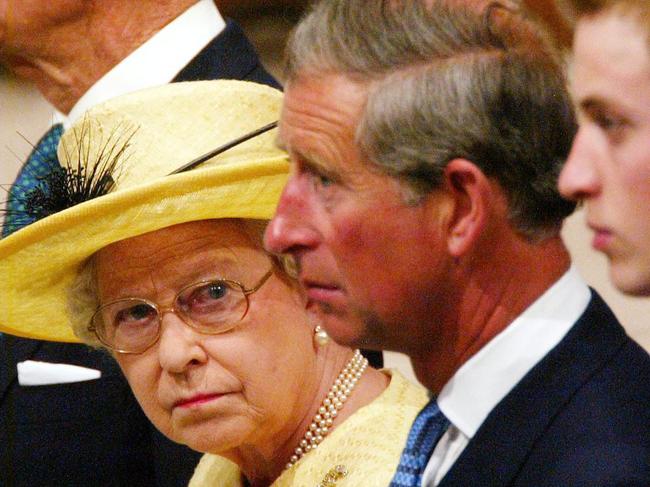 ##AFP PIC FEE PAYABLE CHECK BEFORE USE## Queen Elizabeth II looks across to  Prince Charles (C) and  Prince William (R) during the ceremony marking the 50th anniversary of her coronation at Westminster Abbey in /London on 02 Jun 2003. picRussell/Boyce headshot profile royalty britain families