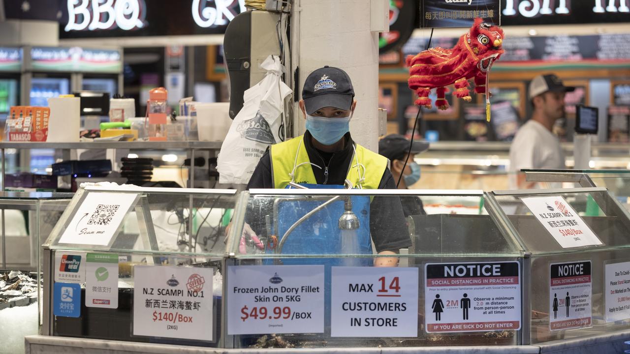 A worker is pictured at the Sydney Fish Market is also applying strict social distancing measures. Picture: Brook Mitchell/Getty Images