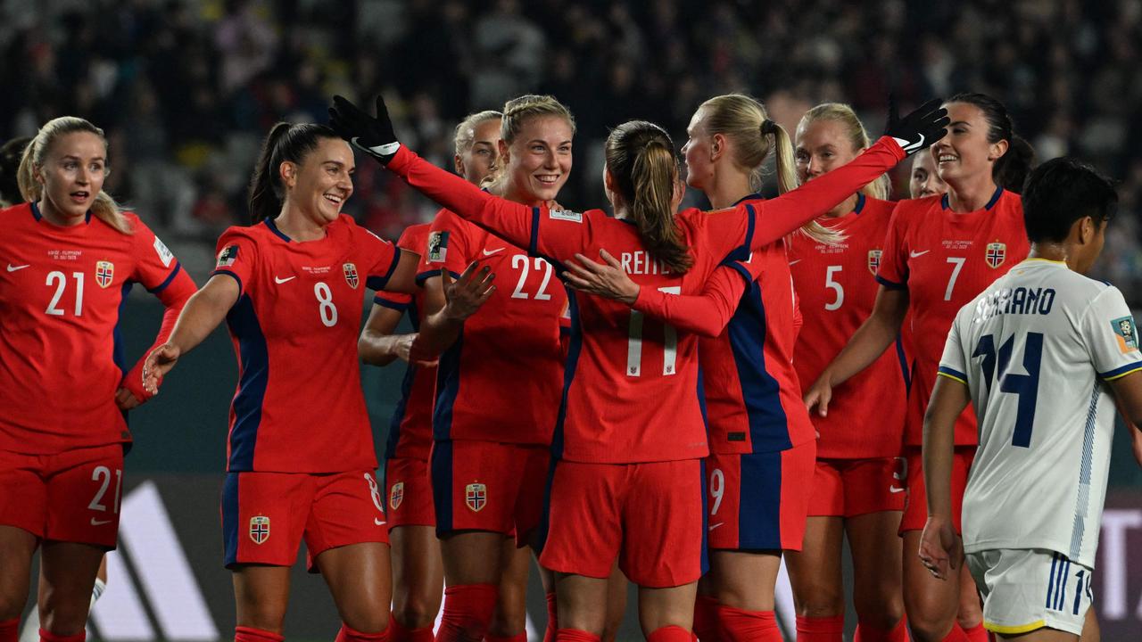 TOPSHOT - Norway's forward #22 Sophie Roman Haug (C) celebrates with her teammates after scoring her team's sixth goal during the Australia and New Zealand 2023 Women's World Cup Group A football match between Norway and the Philippines at Eden Park in Auckland on July 30, 2023. (Photo by Saeed KHAN / AFP)