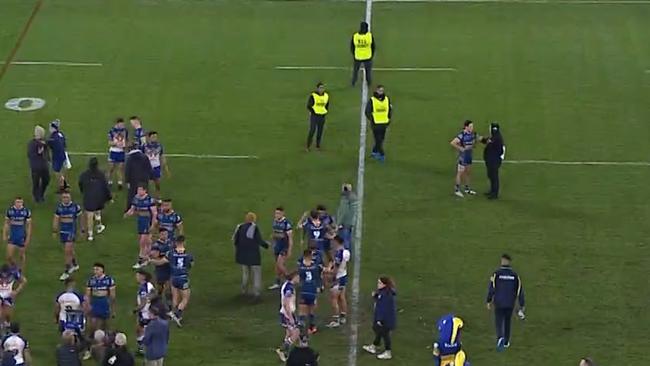 Mitchell Moses (top right doing a radio interview) was shadowed by security last Friday night.