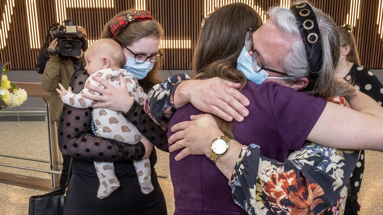 Relatives are reunited after a flight from Wellington, NZ, lands at Melbourne Airport. Picture: Jake Nowakowski.