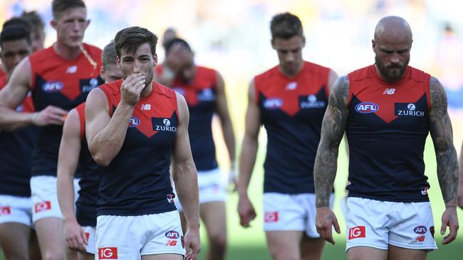 Jack Viney and Nathan Jones lead the Demons off the field after their massive loss to West Coast. Picture: AAP