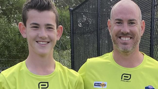 Oscar Wakeling and his dad Brad before their umpiring debut this season.