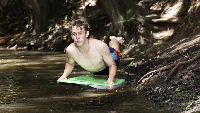 Cairns is currently experiencing hot and sticky weather typical of the start of summer. Smithfield teenager Riley Swan finds respite from the warm weather by taking a dip in the cool waters of Freshwater Creek. Picture: Brendan Radke