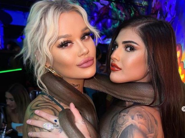 A Melbourne bar has been slammed for bringing live reptiles to its relaunch on the weekend, with photos showing influencers holding snakes and baby crocodiles sending Instagram into uproar. Picture: Instagram