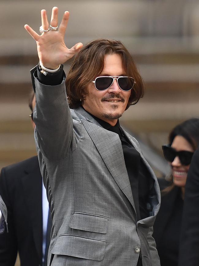 US actor Johnny Depp gestures as he leaves the High Court after the final day of his libel trial. Picture: AFP