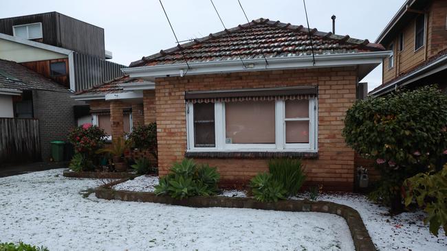 Streets were blanketed in a layer of hailstones. Picture: Brendan Beckett