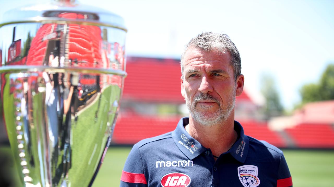 Adelaide United coach Marco Kurz with the FFA Cup (AAP Image/Kelly Barnes)