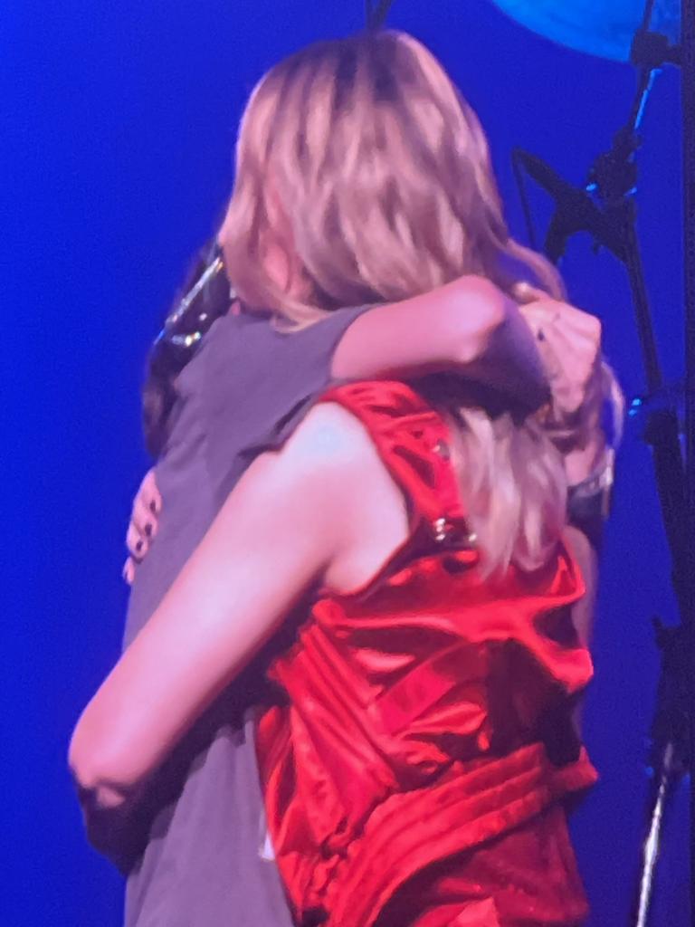 Kylie Minogue hugging an unidentified fan on stage at the Tension Tour at Adelaide Entertainment Centre on February 18, 2025. Picture: Anna Vlach