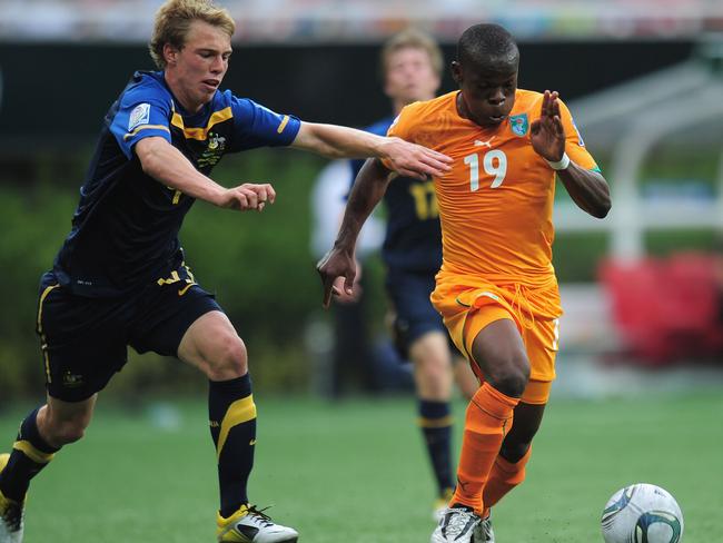 Tom King challenges Ivory Coast’s Souleymane Coulibaly during the 2011 U/17 World Cup in Mexico. Picture: Getty Images