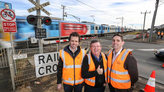 North West Program Alliance general manager Ben Ryan, Broadmeadows MP Frank McGuire and project director Michael Caink at the Camp Rd level crossing in Campbellfield. Picture: Tim Carrafa