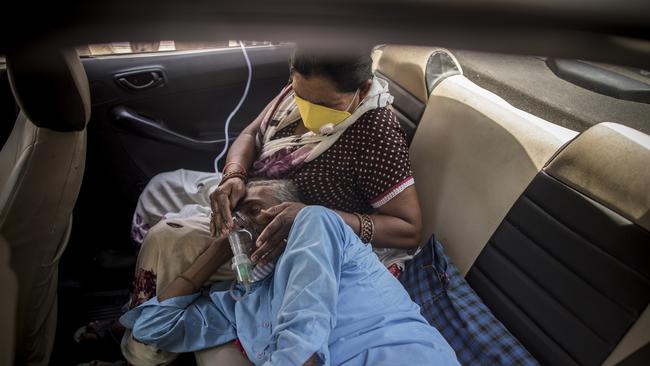 People infected with Covid-19 receive oxygen in their cars, supplied as a part of public service for the people in need by a Gurdwara or a Sikh Holy place. Oxygen is in short supply in the country. Picture: Getty