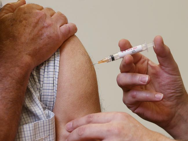 The Federal Government has recommended that people under the age of 50 not receive the AstraZeneca COVID-19 coronavirus vaccine, due to the extremely small chance of the patient developing blood clots. Geoff Isaacs receives a dose of the AstraZeneca COVID-19 vaccine from general practitioner Dr. Anthony Kresevic at the Edmonton Family Medical Centre. Picture: Brendan Radke