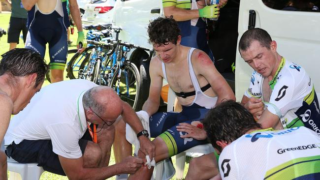 Daryl Impey gets treatment from Dr Peter Barnes at the Orica GreedEDGE bus after crashing near the Stage 2 finish. Photo Sarah Reed.