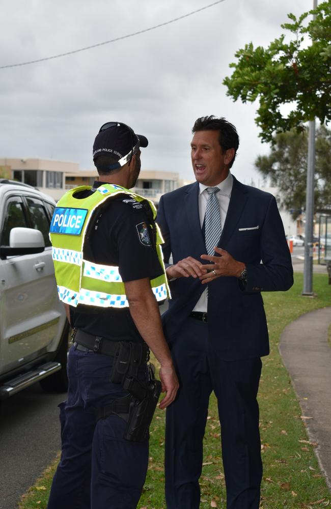 Police minister Dan Purdie speaking to a police officer conducting roadside breath tests on Alexandra Parade, Alexandra Headland.