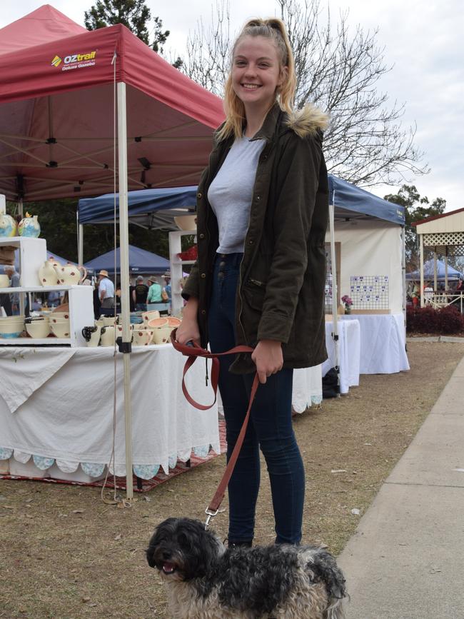 Micah O'Sullivan with dog Peppah at the Potter's Craft Market for Jumpers and Jazz in July.